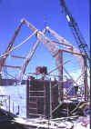 027-First trusses being hoisted into position.JPG (54636 bytes)
